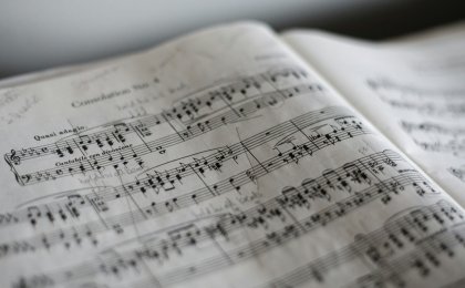Handwritten sheet music symbolizing dopamine’s role in creativity, focus, and reward