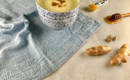 Golden turmeric latte with ginger, honey, and cardamom—ingredients known for anti-inflammatory and immune-boosting benefits